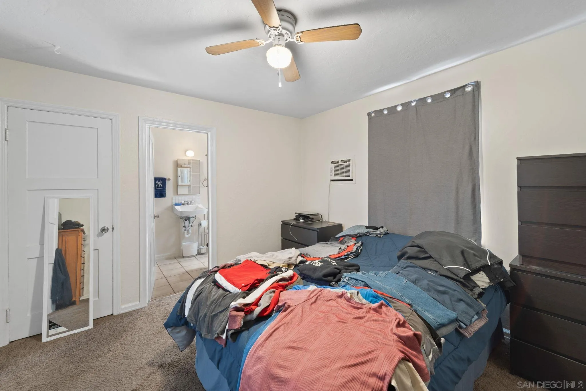 345 Cedar Street El Cajon, CA 92021 - Photo 10 of 19 a bed room with a bed and a ceiling fan