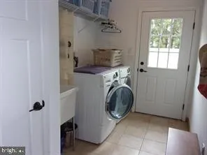 a bathroom with a granite countertop shower