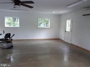 a bedroom with a bed a table and chair