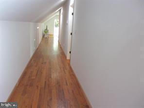 28880 Hudson Road Dagsboro, DE 19939 - Photo 18 of 29 a view of a hallway with wooden floor