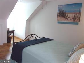 28880 Hudson Road Dagsboro, DE 19939 - Photo 19 of 29 a bedroom with a bed and painting on the wall