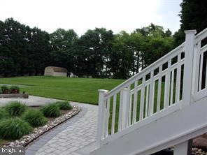 28880 Hudson Road Dagsboro, DE 19939 - Photo 26 of 29 a view of a balcony with wooden floor and fence