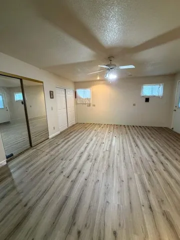 a view of an empty room and a windows