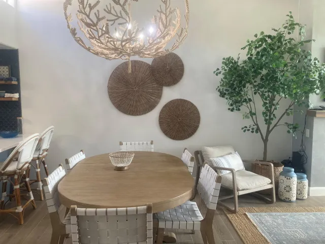 a dining room with furniture and wooden floor