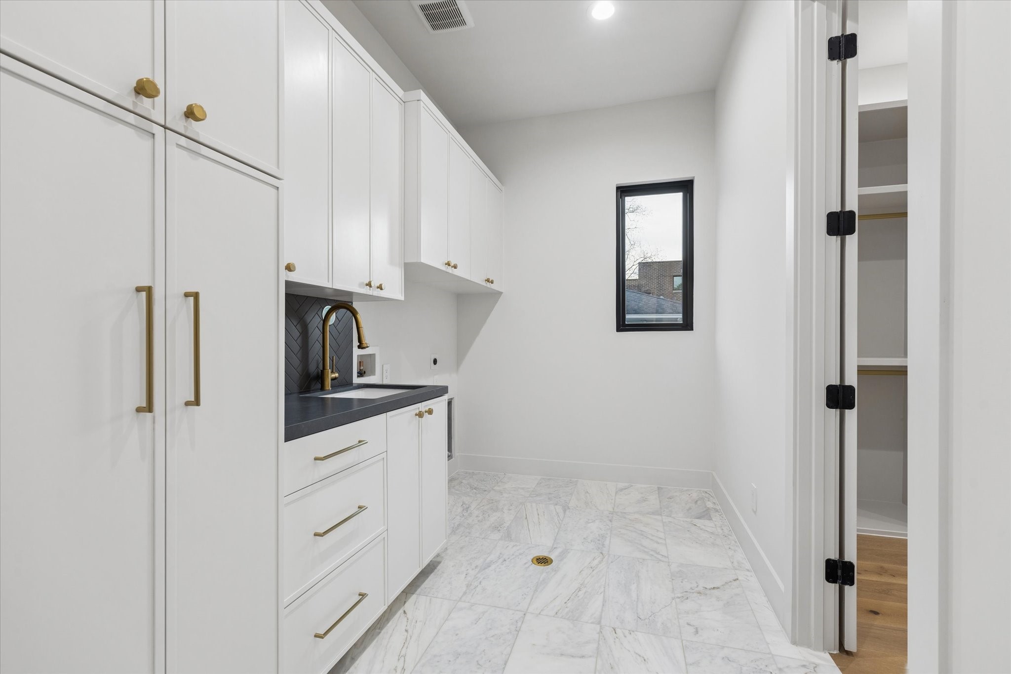 2102 Tangley Street Houston, TX 77005 - Photo 34 of 49 a kitchen with white cabinets and white appliances