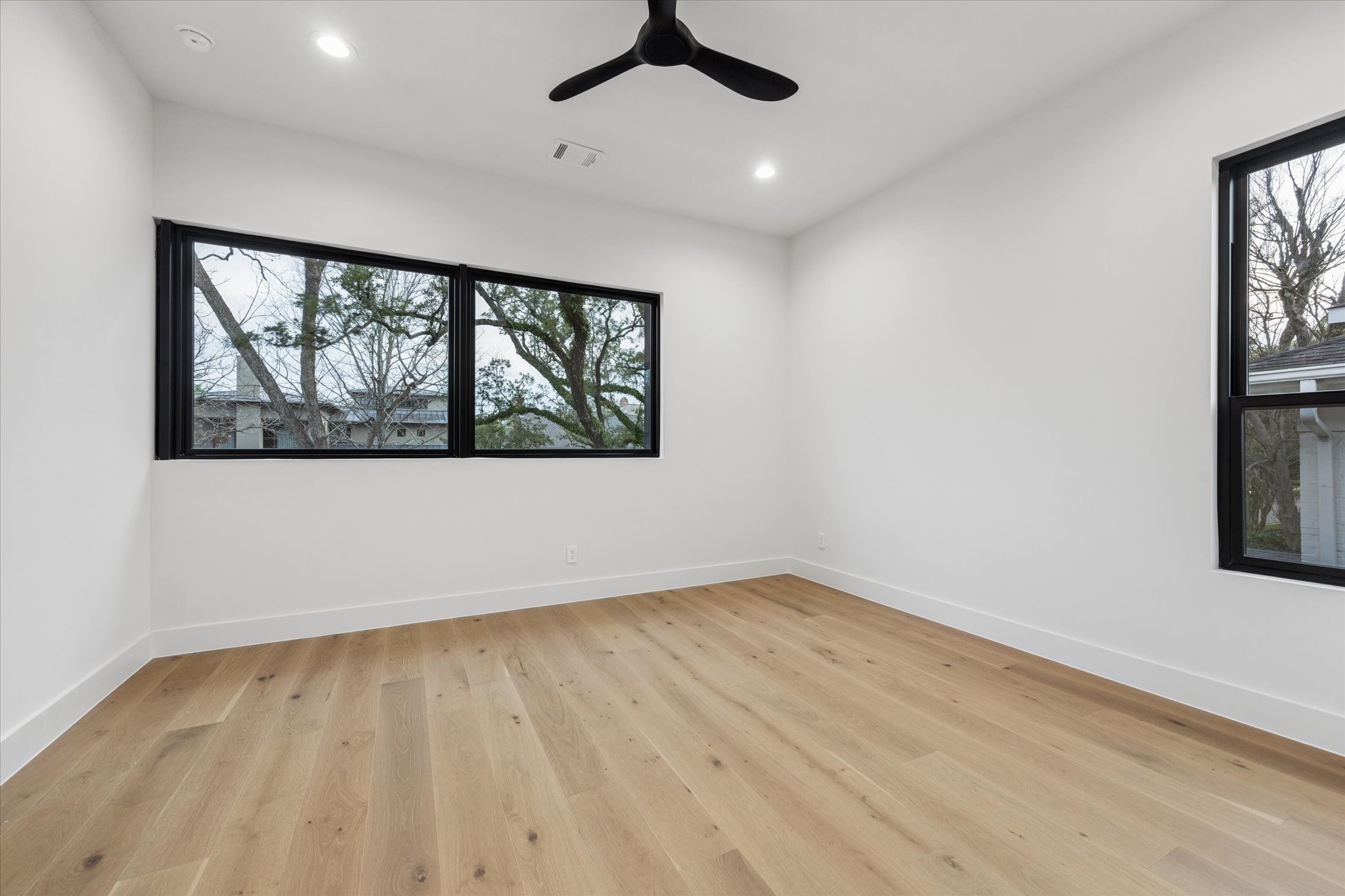 2102 Tangley Street Houston, TX 77005 - Photo 39 of 49 wooden floor in an empty room with a window