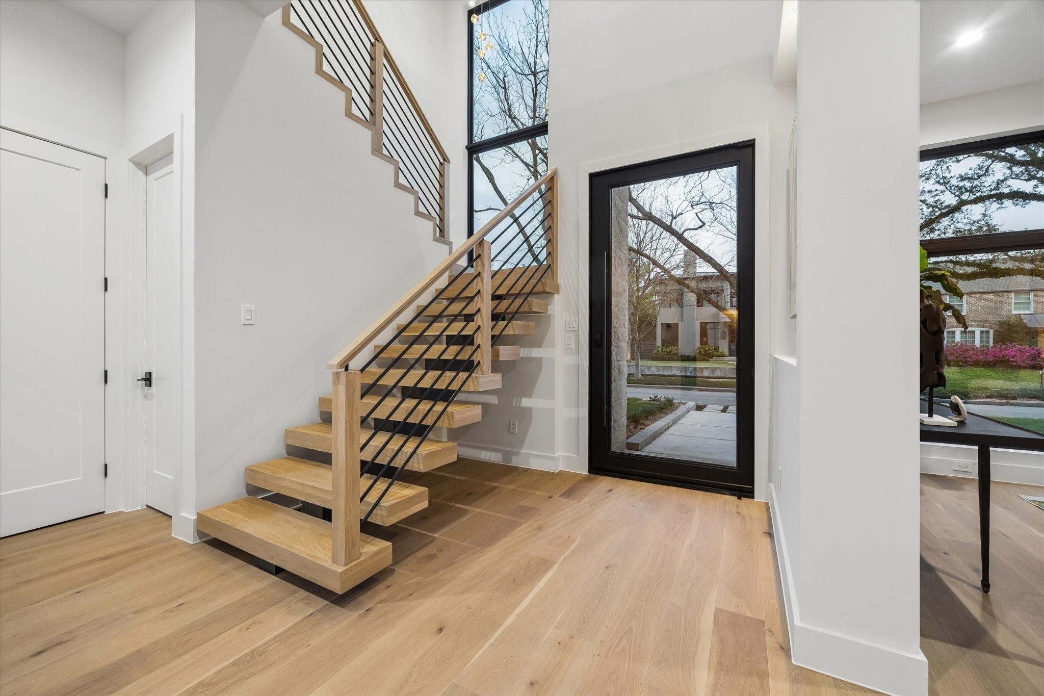 2102 Tangley Street Houston, TX 77005 - Photo 4 of 49 a view of an entryway with wooden floor and door