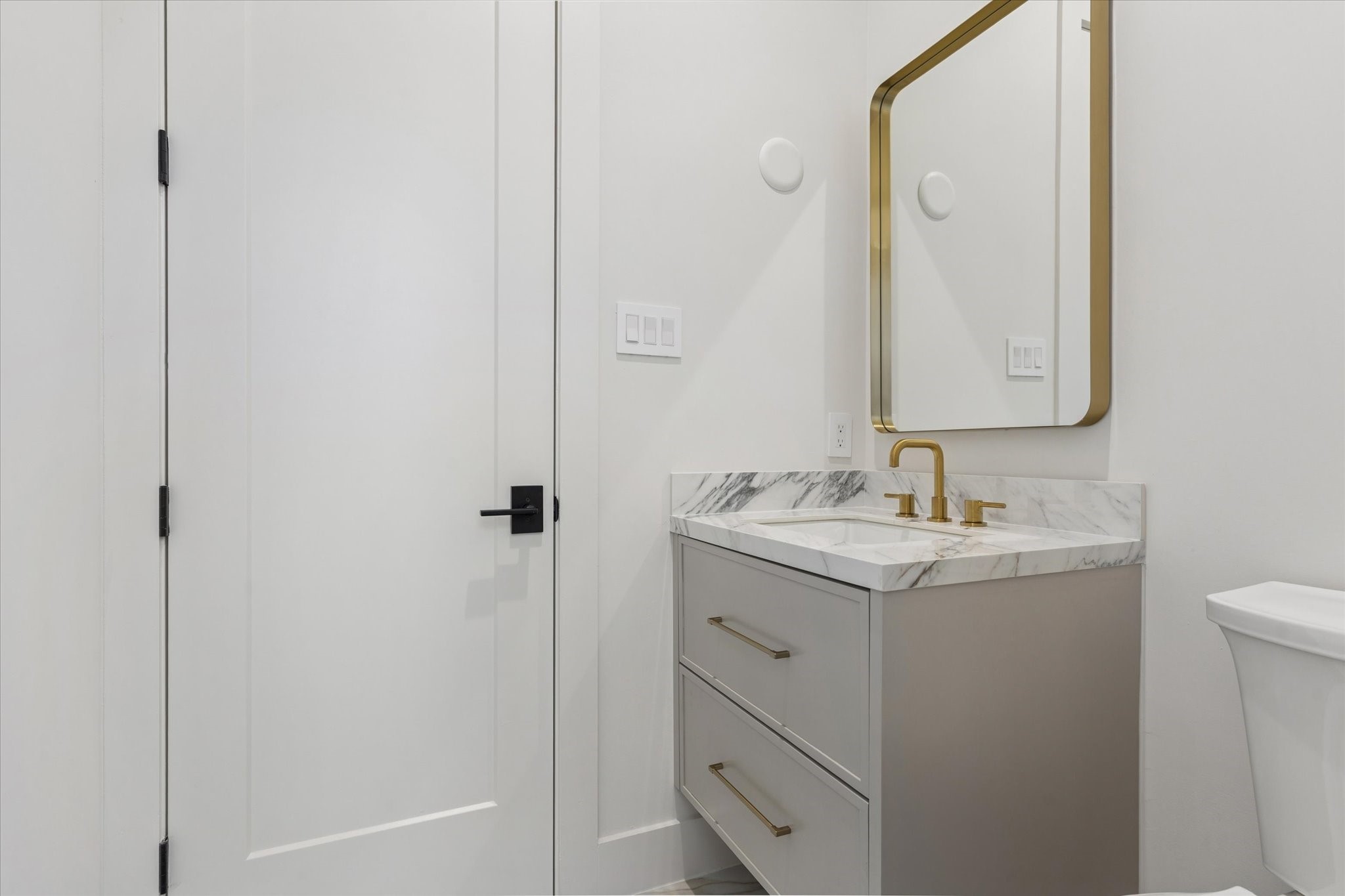 2102 Tangley Street Houston, TX 77005 - Photo 42 of 49 a bathroom with a sink and mirror with toilet