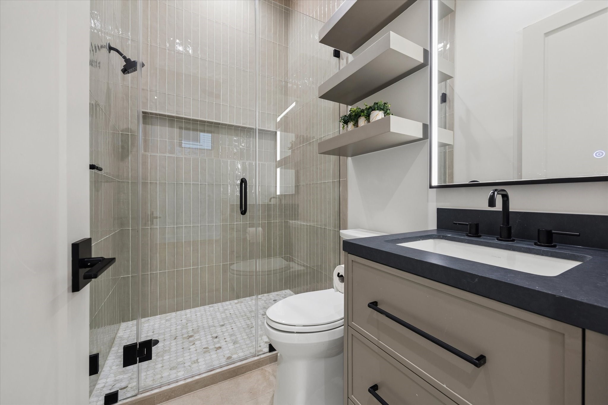 2102 Tangley Street Houston, TX 77005 - Photo 43 of 49 a bathroom with a granite countertop sink a toilet and shower