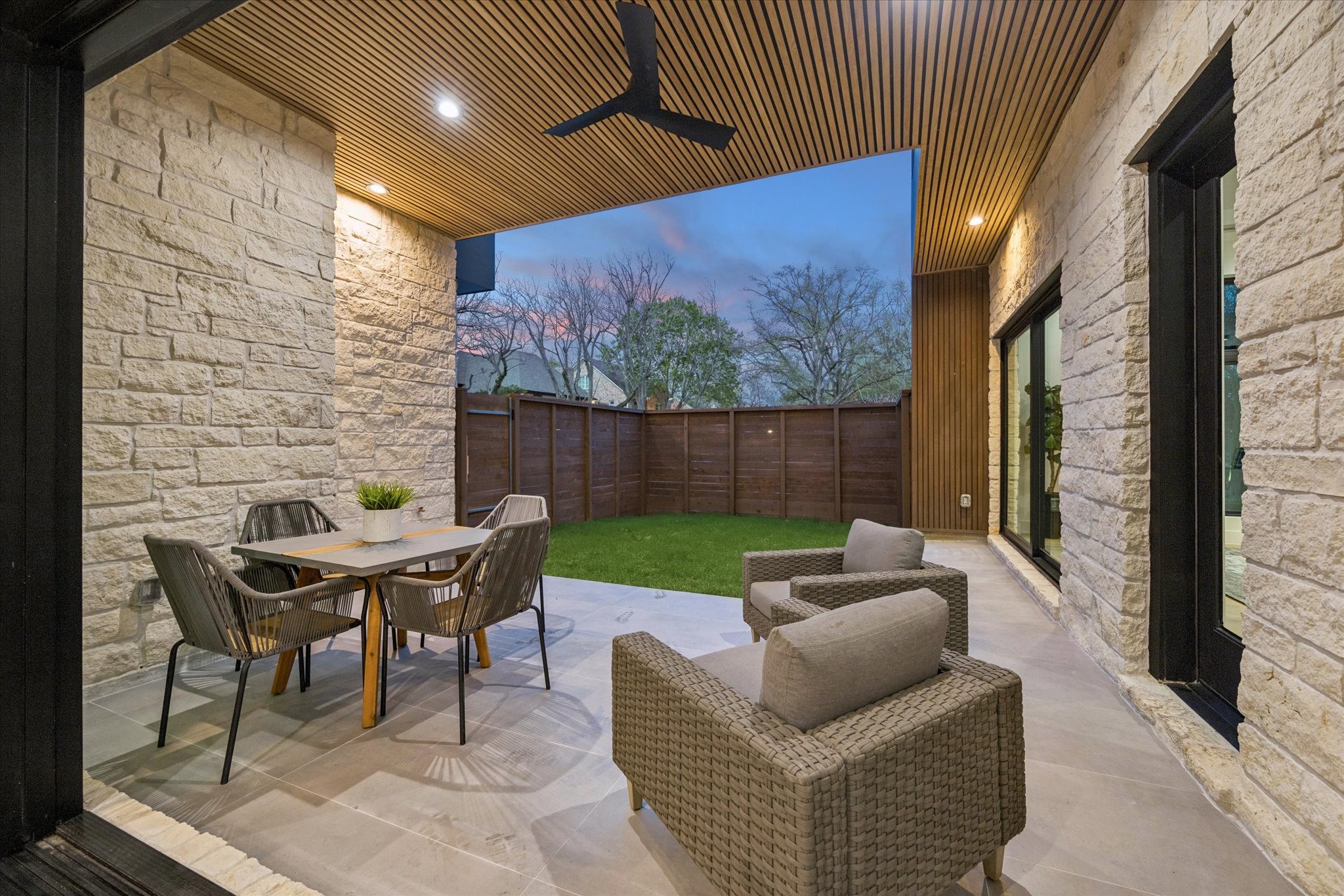 2102 Tangley Street Houston, TX 77005 - Photo 46 of 49 a outdoor living space with furniture and a floor to ceiling window