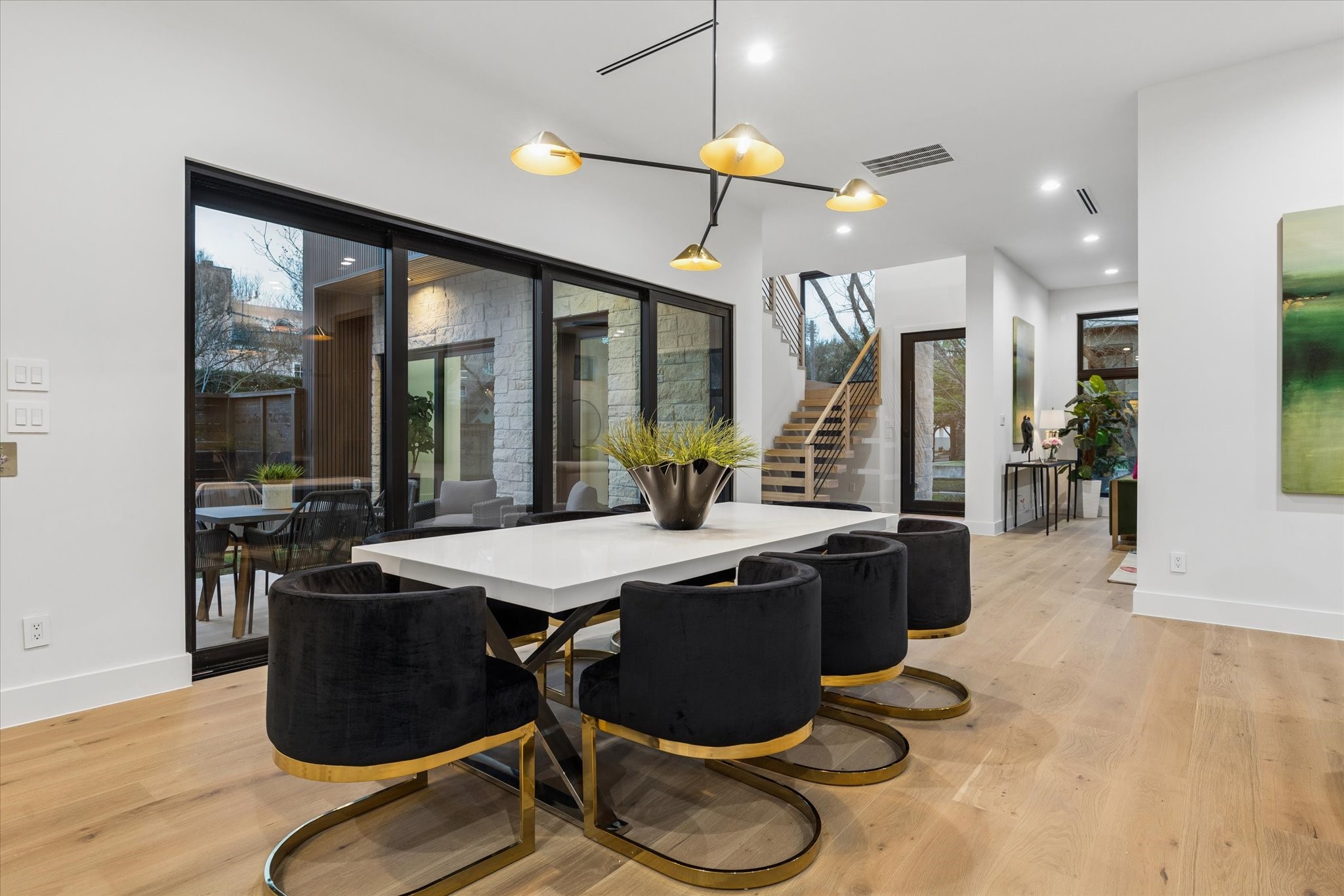 2102 Tangley Street Houston, TX 77005 - Photo 9 of 49 a view of a dining room with furniture wooden floor and chandelier