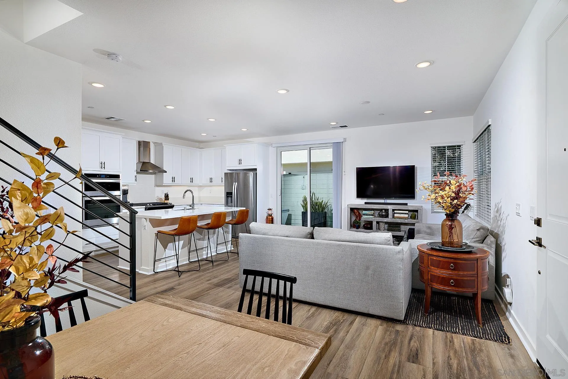13070 Olympus Circle, Unit 1 Poway, CA 92064 - Photo 11 of 28 a living room with furniture and a flat screen tv