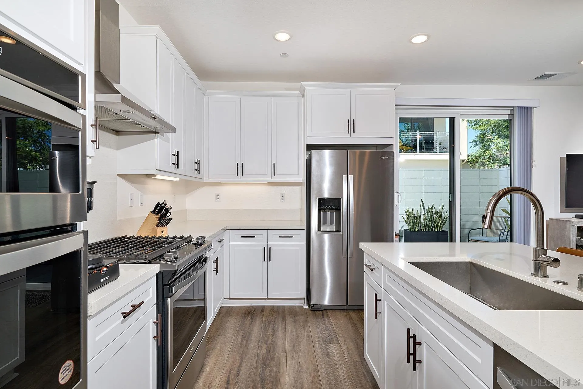 13070 Olympus Circle, Unit 1 Poway, CA 92064 - Photo 15 of 28 a kitchen with a sink stove and refrigerator