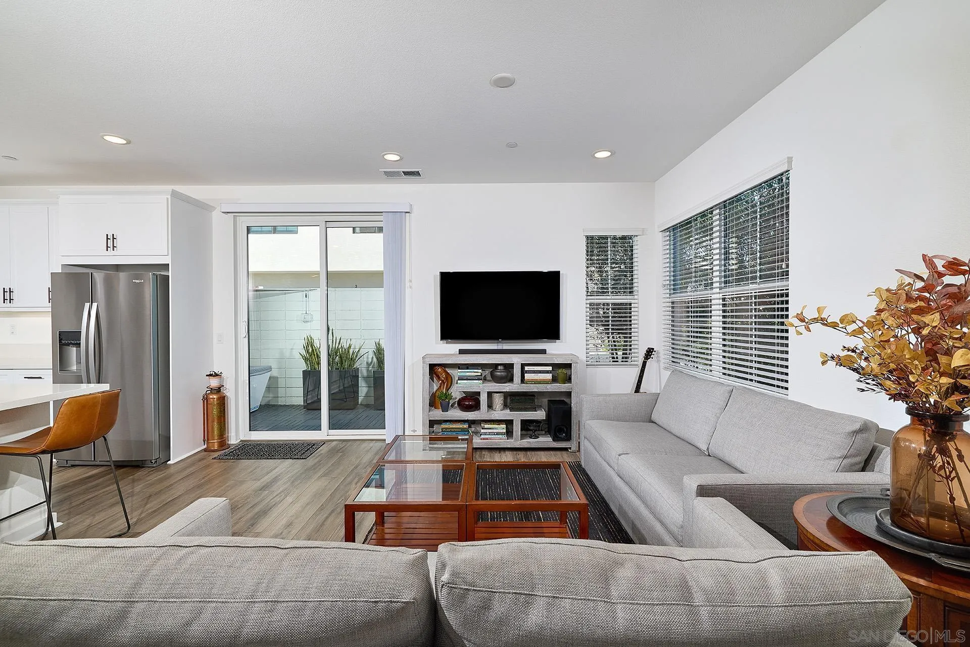 13070 Olympus Circle, Unit 1 Poway, CA 92064 - Photo 6 of 28 a living room with furniture and a flat screen tv