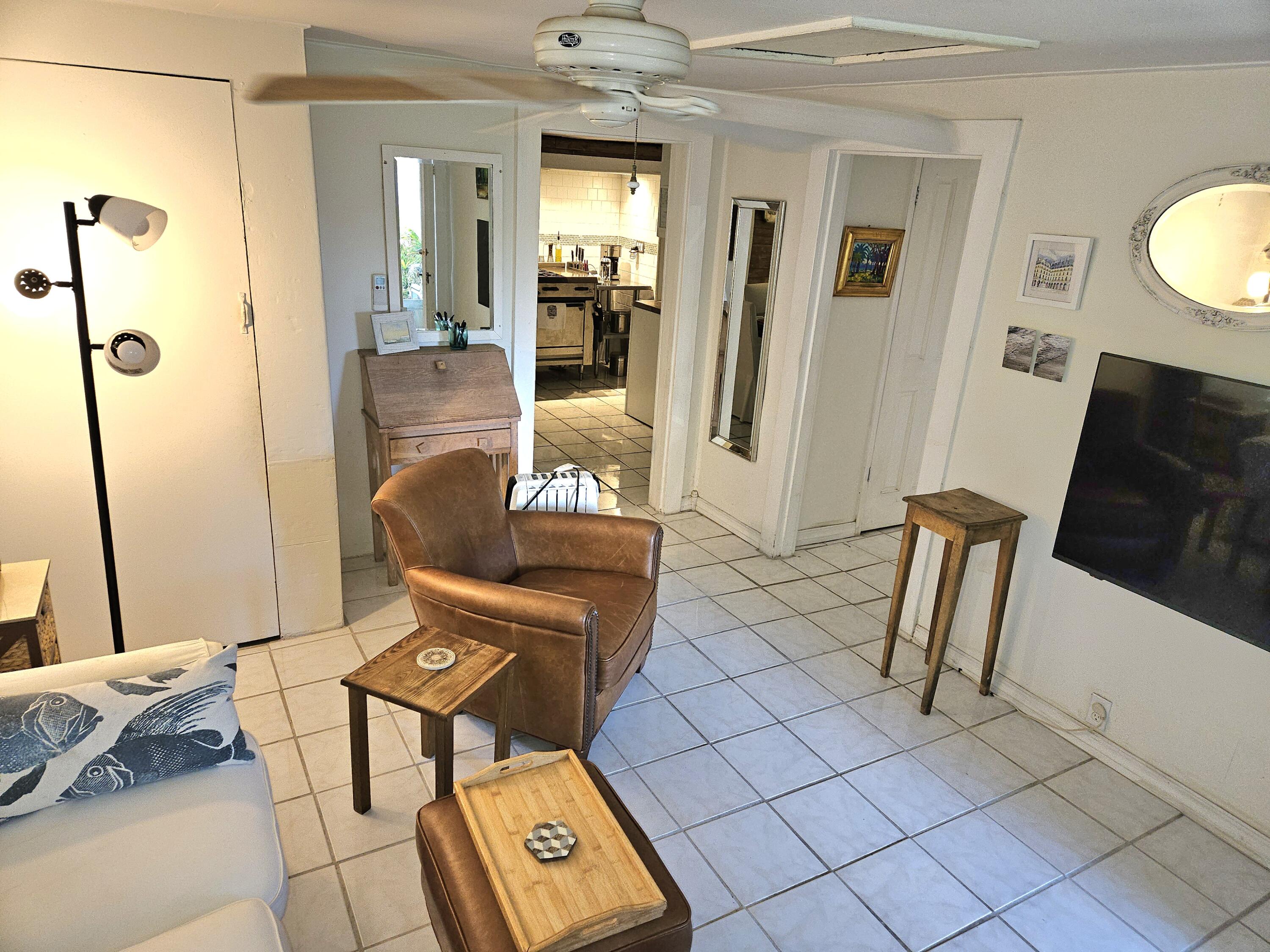 1015 Angela Street Key West, FL 33040 - Photo 23 of 42 a living room with furniture and a window