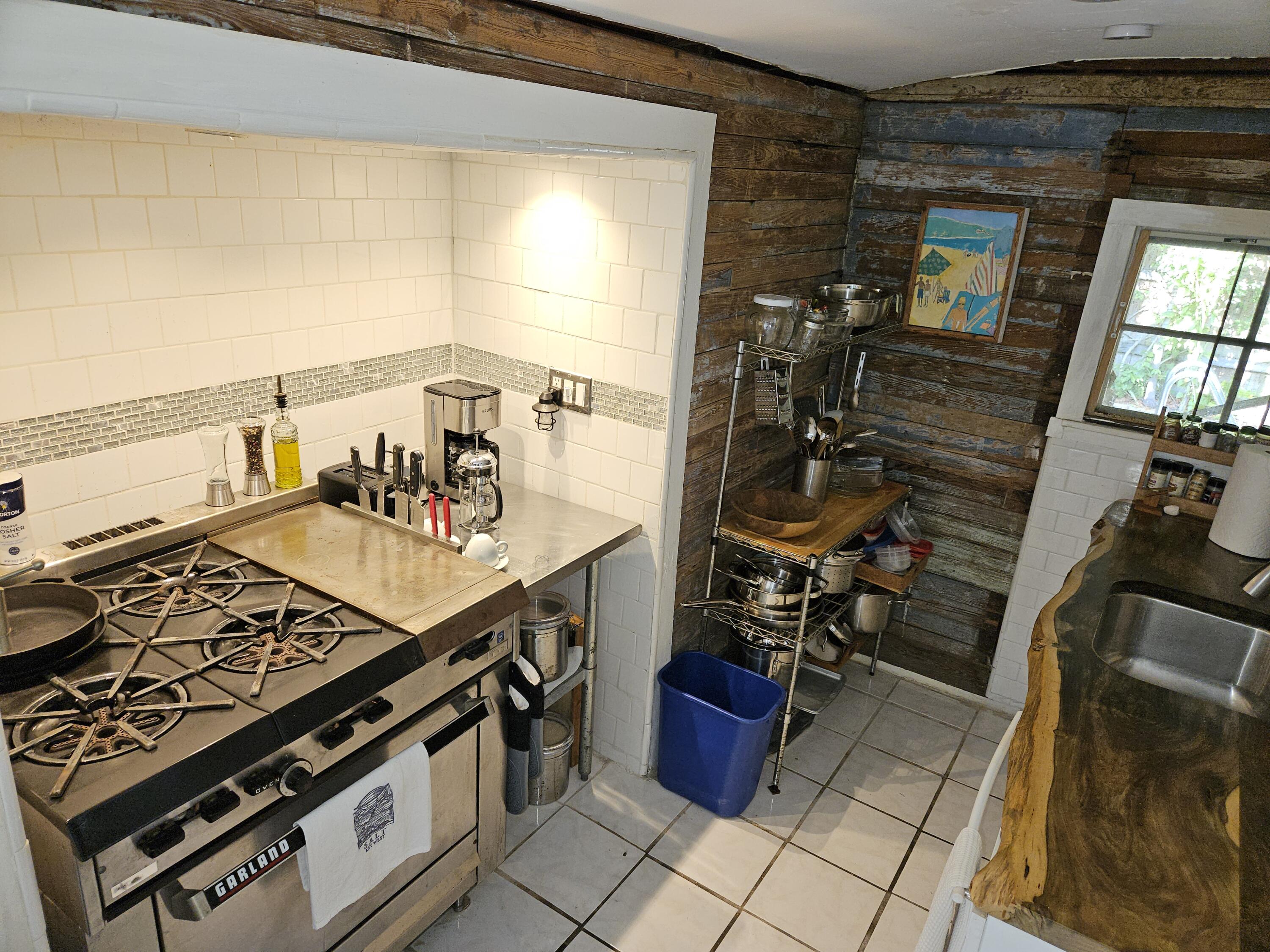 1015 Angela Street Key West, FL 33040 - Photo 28 of 42 a kitchen with a stove and a sink