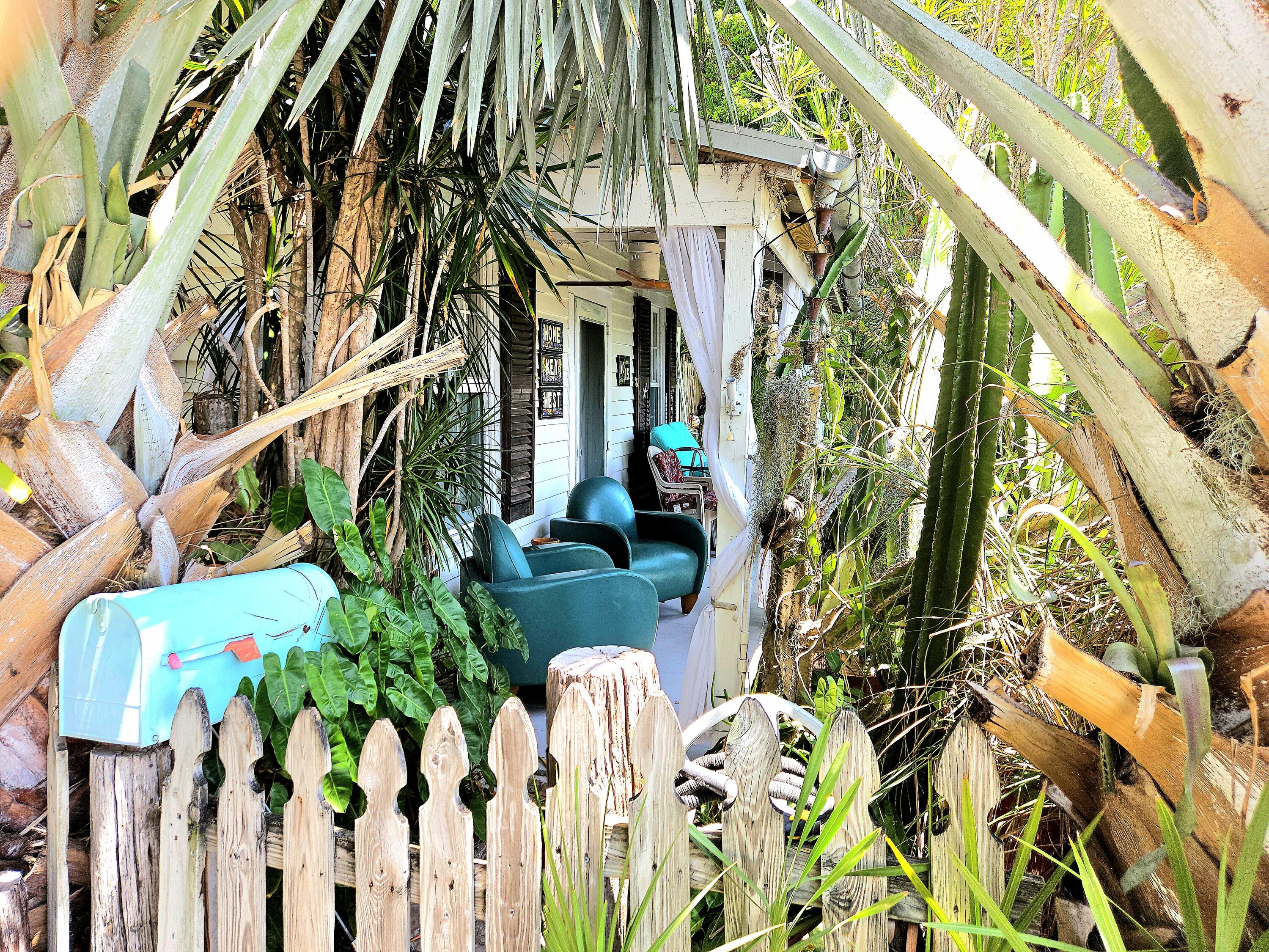 1015 Angela Street Key West, FL 33040 - Photo 9 of 42 a plant is sitting in front of a building