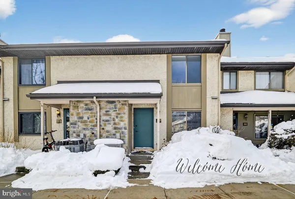 a view of a white building with many windows