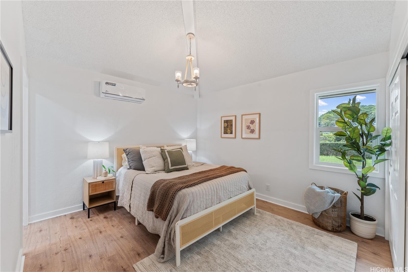 94-84 Keahilele Street Mililani, HI 96789 - Photo 12 of 20 a bedroom with a bed and a potted plant