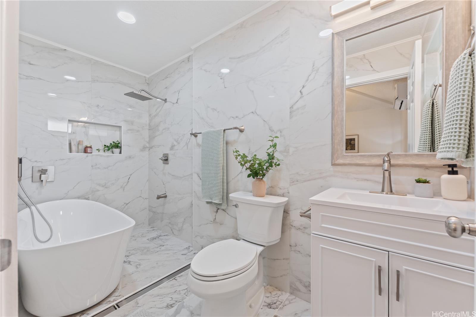 94-84 Keahilele Street Mililani, HI 96789 - Photo 13 of 20 a bathroom with a sink toilet and shower