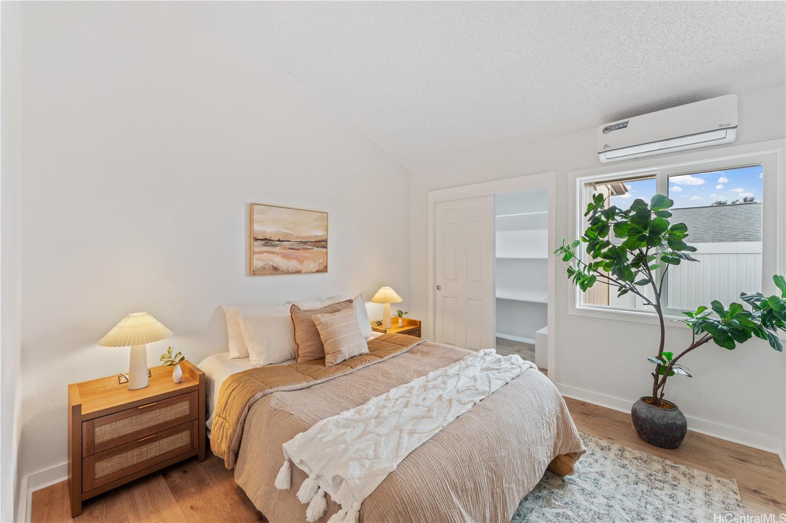94-84 Keahilele Street Mililani, HI 96789 - Photo 14 of 20 a bedroom with bed and a potted plant