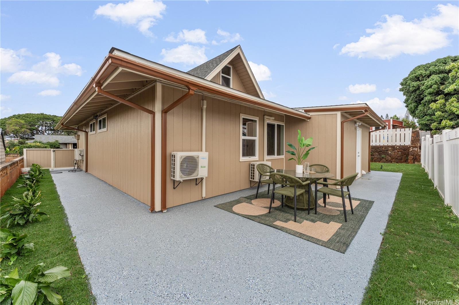 94-84 Keahilele Street Mililani, HI 96789 - Photo 17 of 20 a view of a house with a yard and sitting area