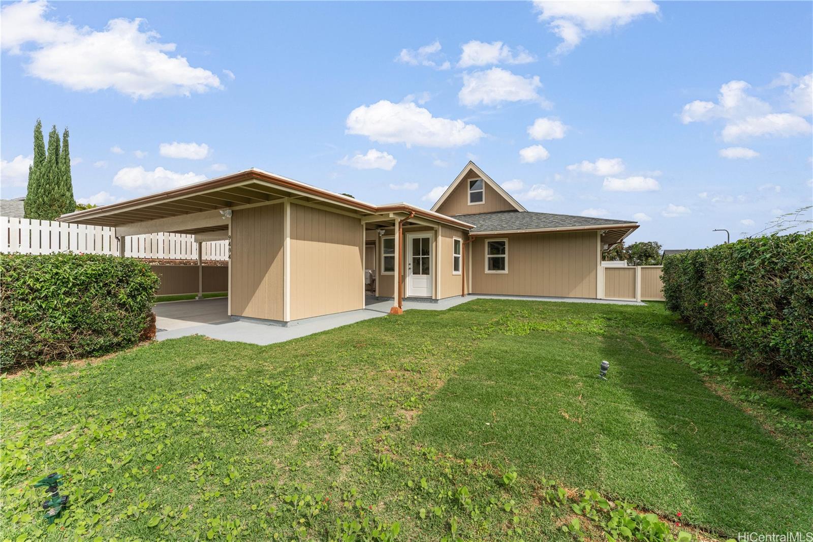 94-84 Keahilele Street Mililani, HI 96789 - Photo 20 of 20 a front view of a house with a garden