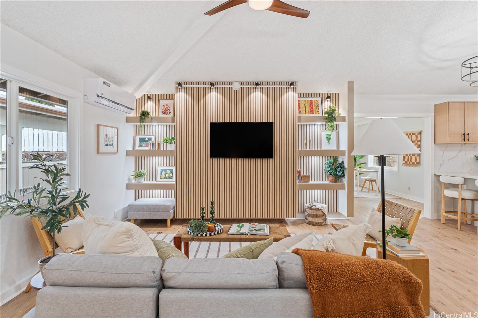 94-84 Keahilele Street Mililani, HI 96789 - Photo 2 of 20 a living room with furniture and a flat screen tv
