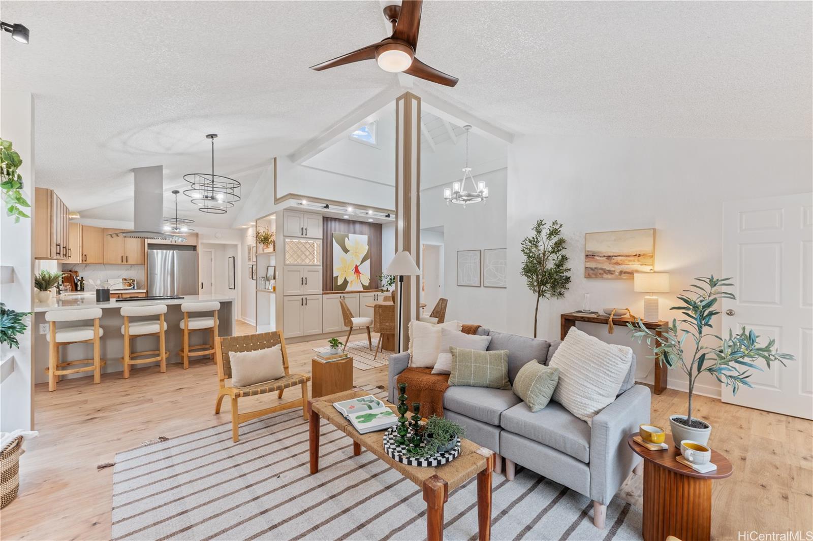 94-84 Keahilele Street Mililani, HI 96789 - Photo 3 of 20 a living room with furniture and a chandelier