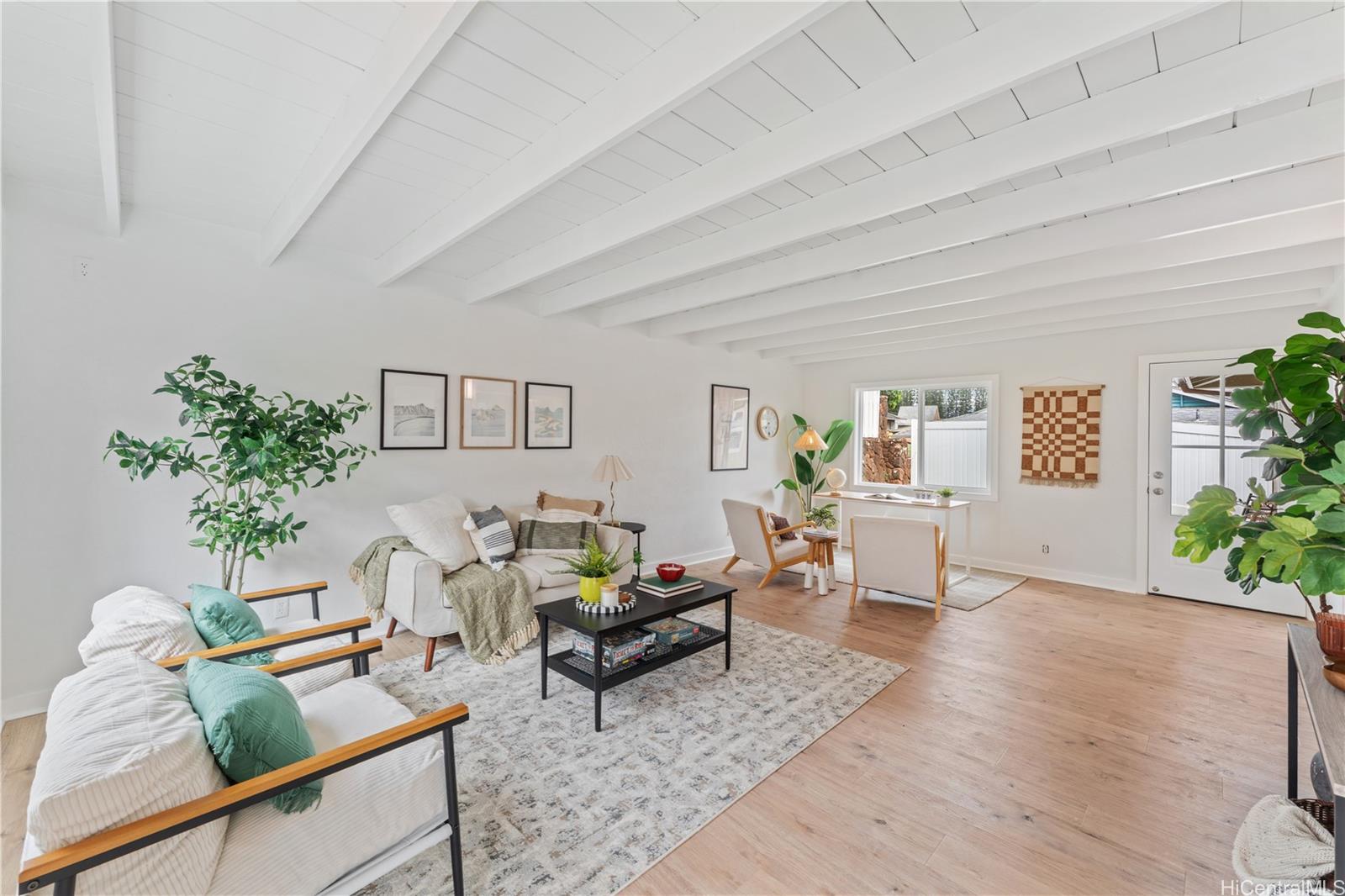 94-84 Keahilele Street Mililani, HI 96789 - Photo 10 of 20 a living room with furniture and flowers