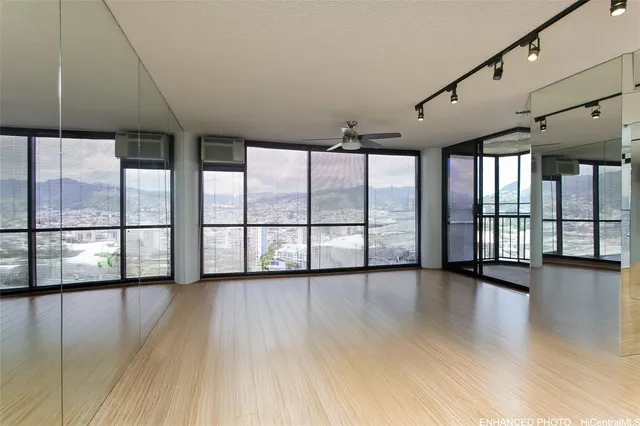 a view of an entryway with wooden floor