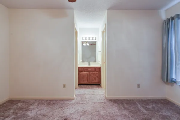 an empty room with mirror