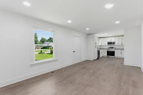 a view of an empty room with a window