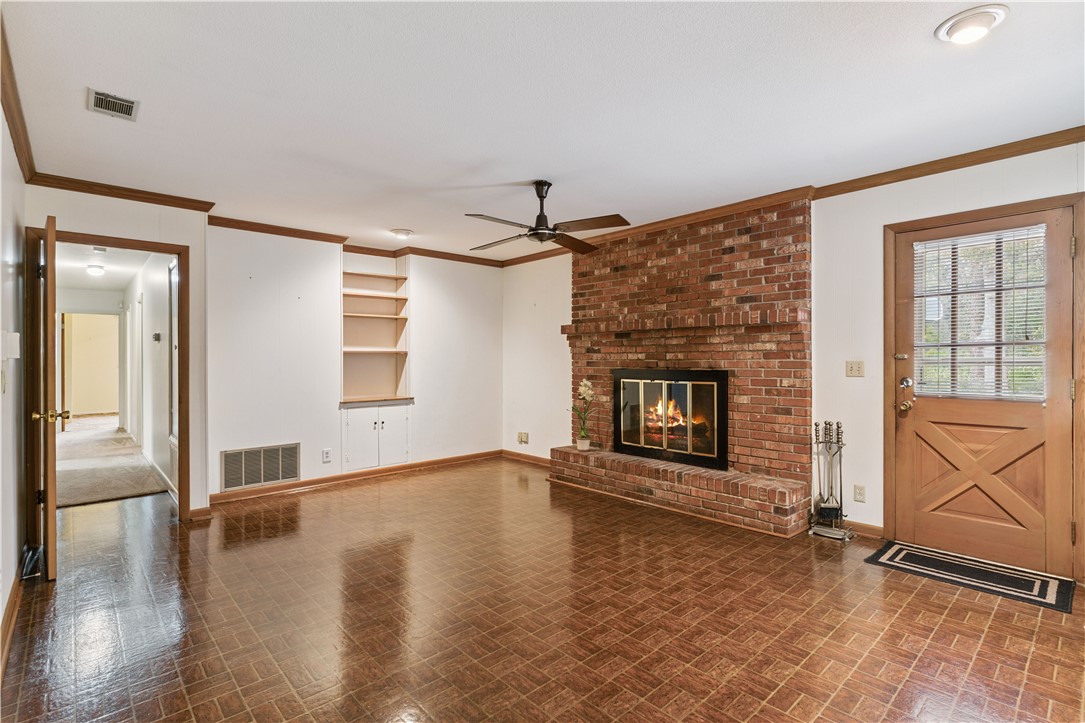 237 King Cotton Road Brunswick, GA 31525 - Photo 17 of 43 So charming! Masonry fireplace and built in shelves.