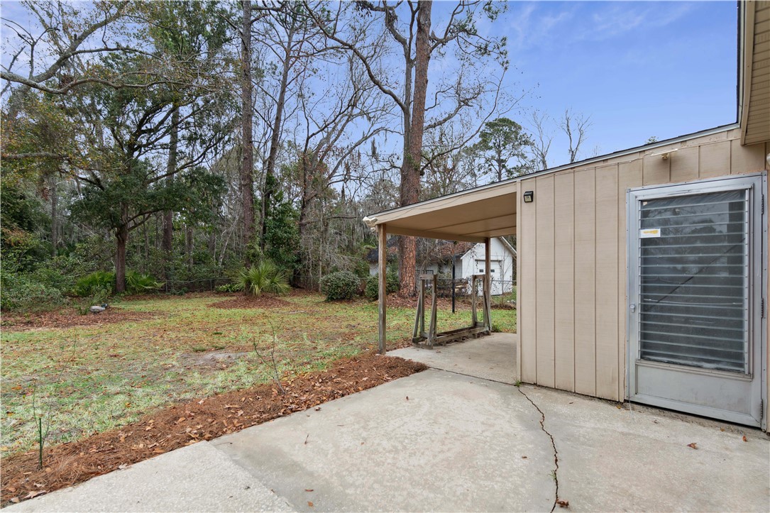 237 King Cotton Road Brunswick, GA 31525 - Photo 31 of 43 Back patio with access to workshop and covered patio/work area.