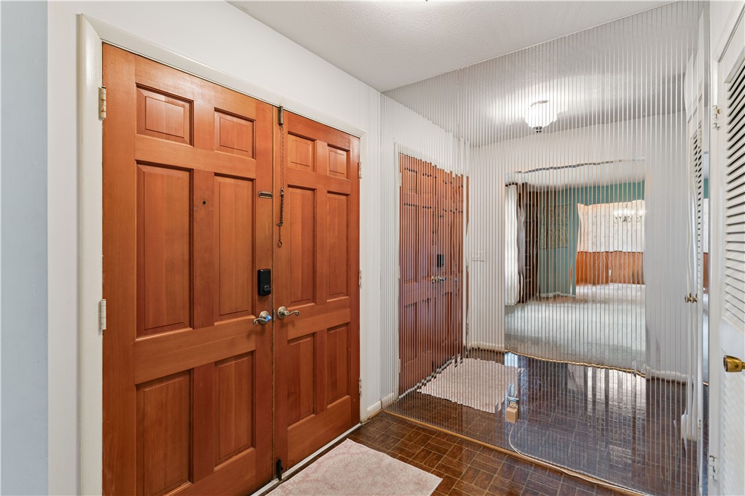 237 King Cotton Road Brunswick, GA 31525 - Photo 9 of 43 Solid wood double doors welcome you in to the foyer.