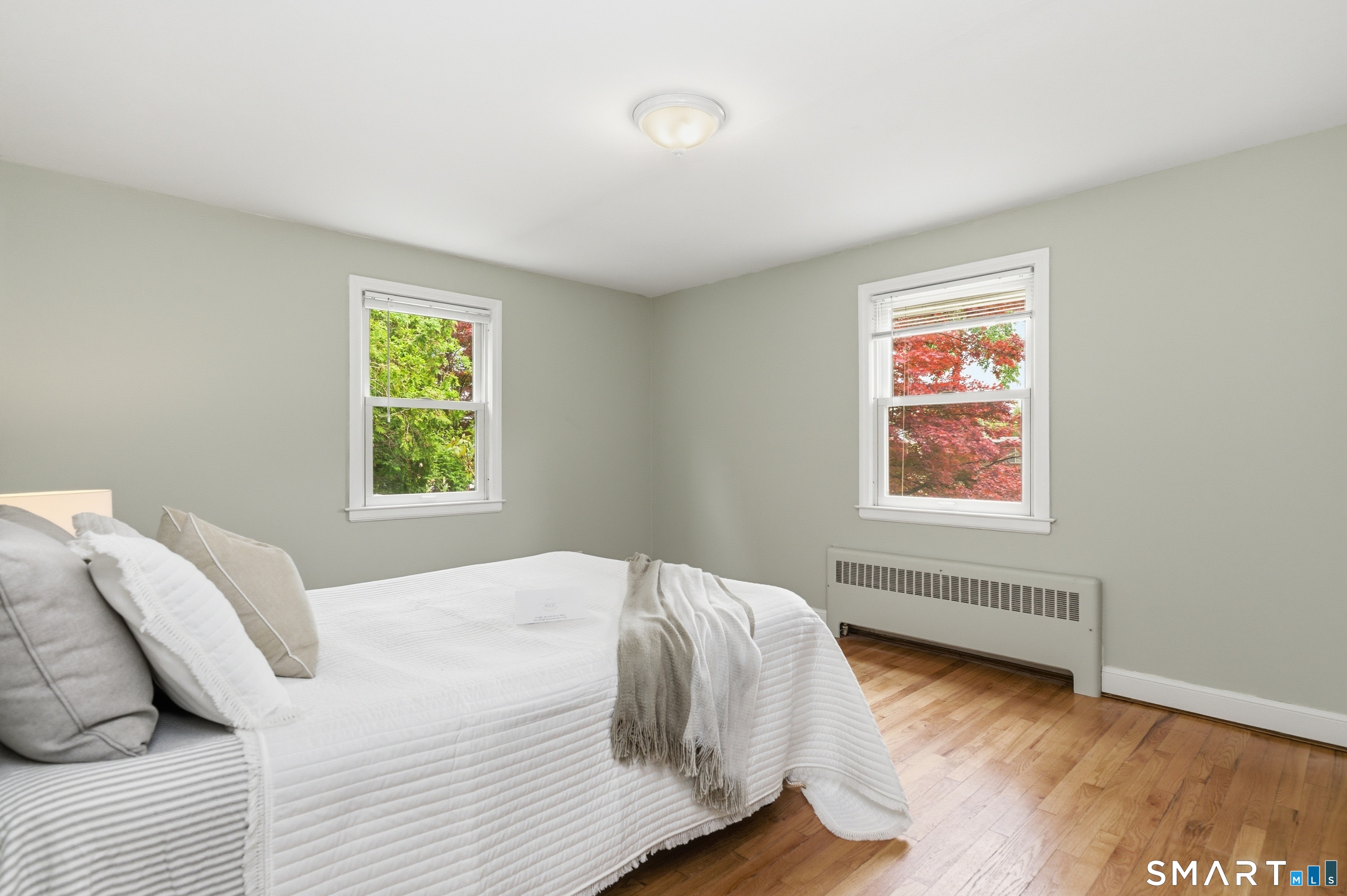 149 Mill Street Wethersfield, CT 06109 - Photo 10 of 29 a bedroom with a bed and a window