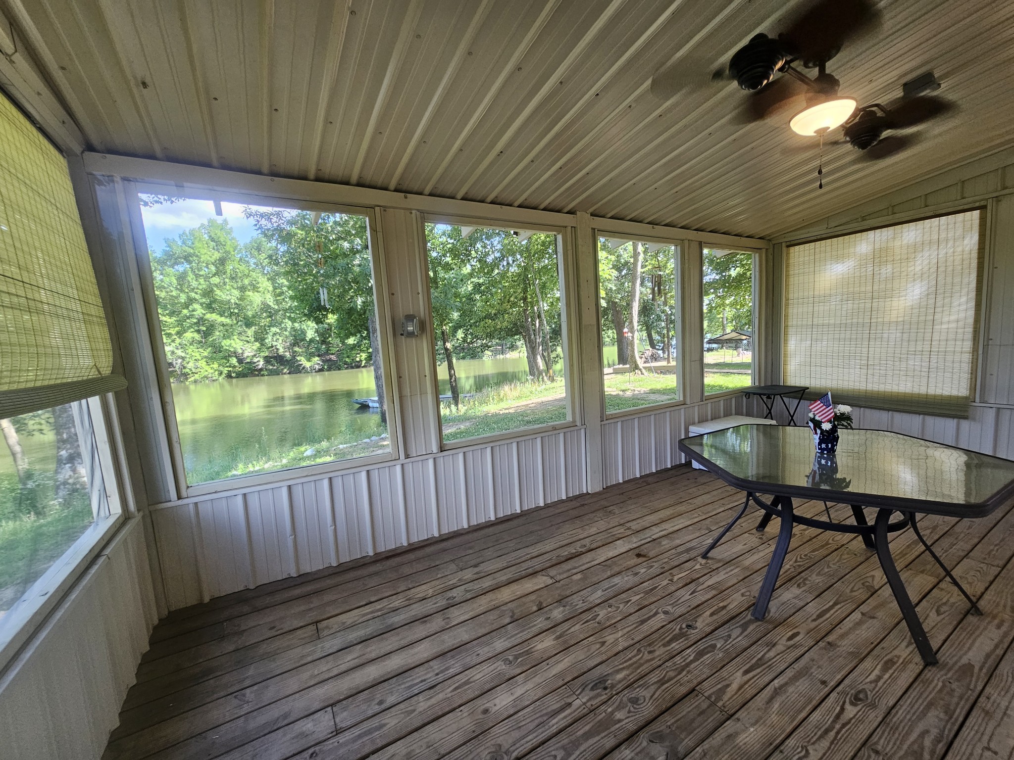 368 Duck Blind Road Clifton, TN 38425 - Photo 18 of 46 a view of a deck with wooden floor and outdoor seating