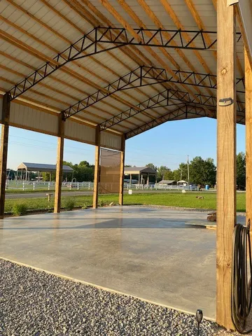 a view of a swimming pool with a yard