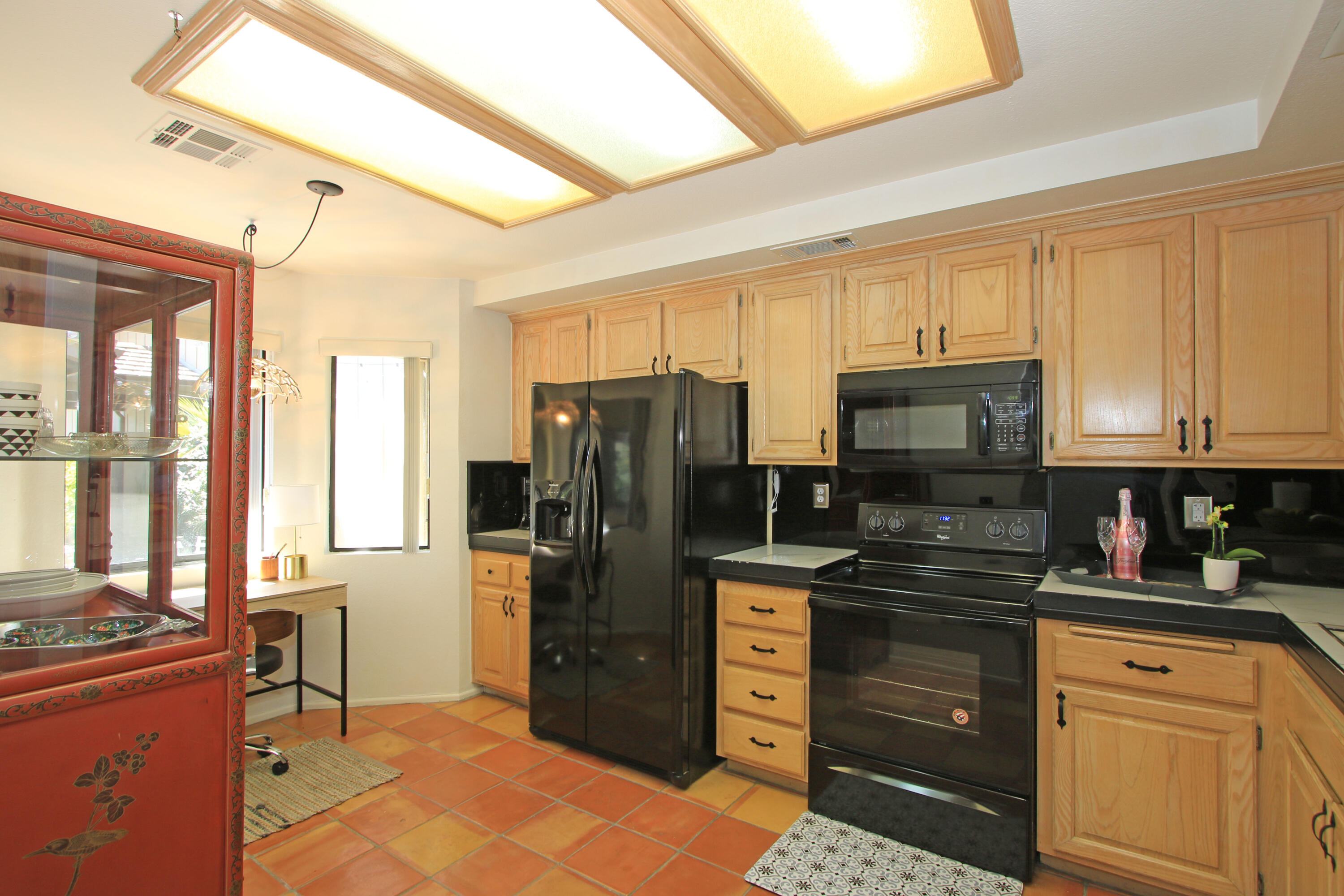 72 Old Ranch Road Palm Desert, CA 92211 - Photo 13 of 35 a kitchen with stainless steel appliances a refrigerator stove and microwave