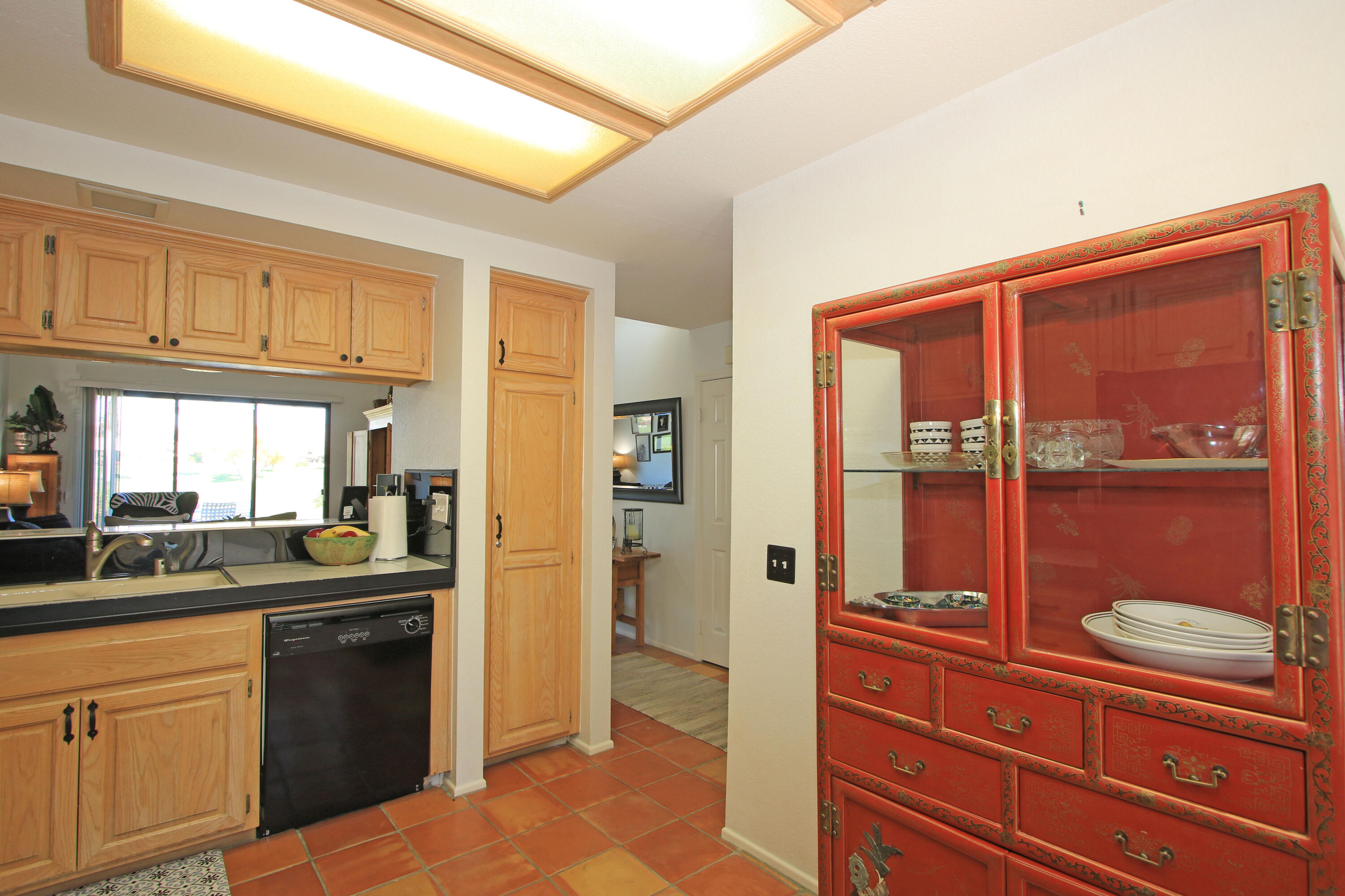 72 Old Ranch Road Palm Desert, CA 92211 - Photo 15 of 35 a kitchen with granite countertop a refrigerator and stove