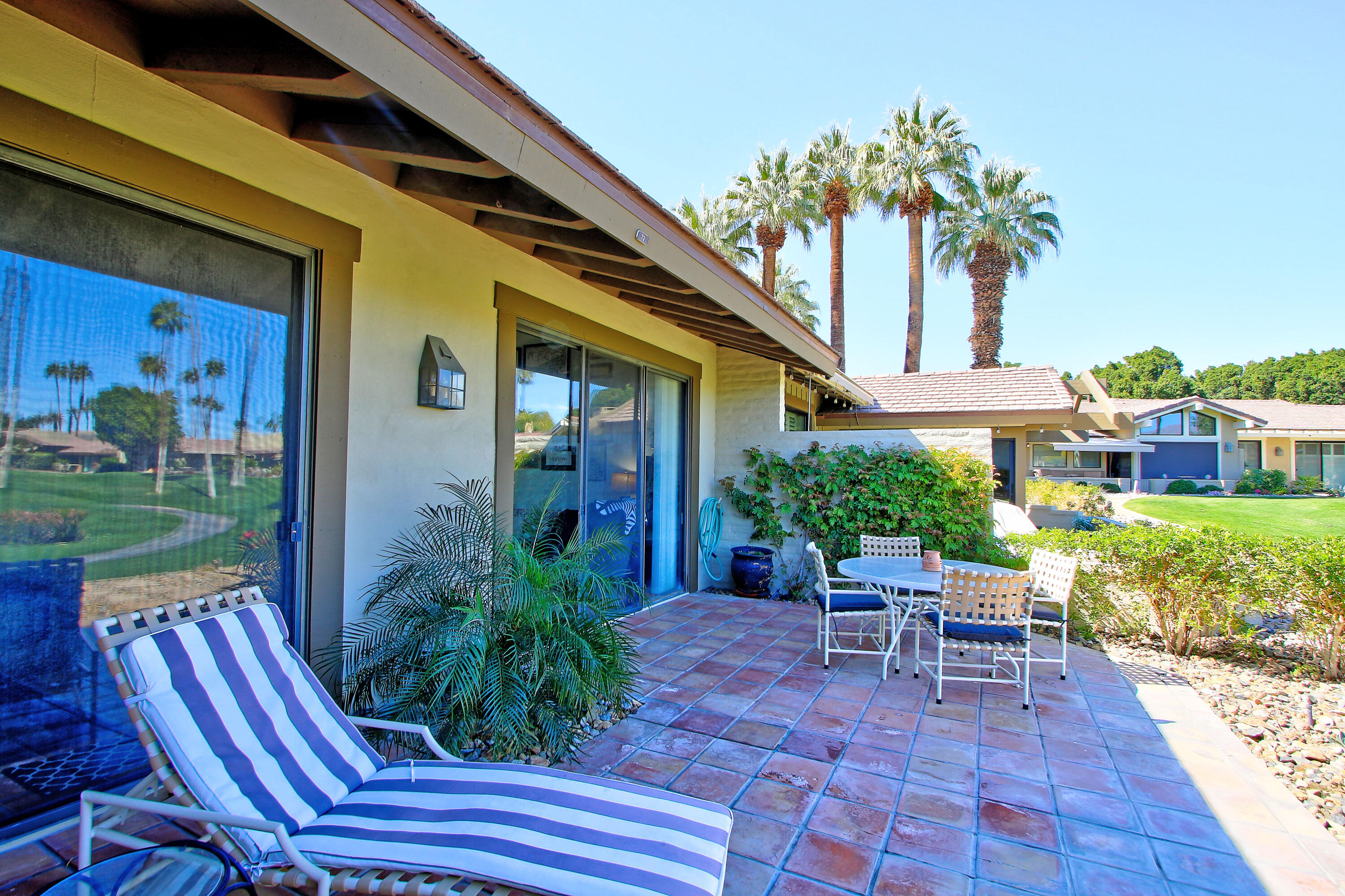 72 Old Ranch Road Palm Desert, CA 92211 - Photo 22 of 35 a view of a house with backyard and sitting area
