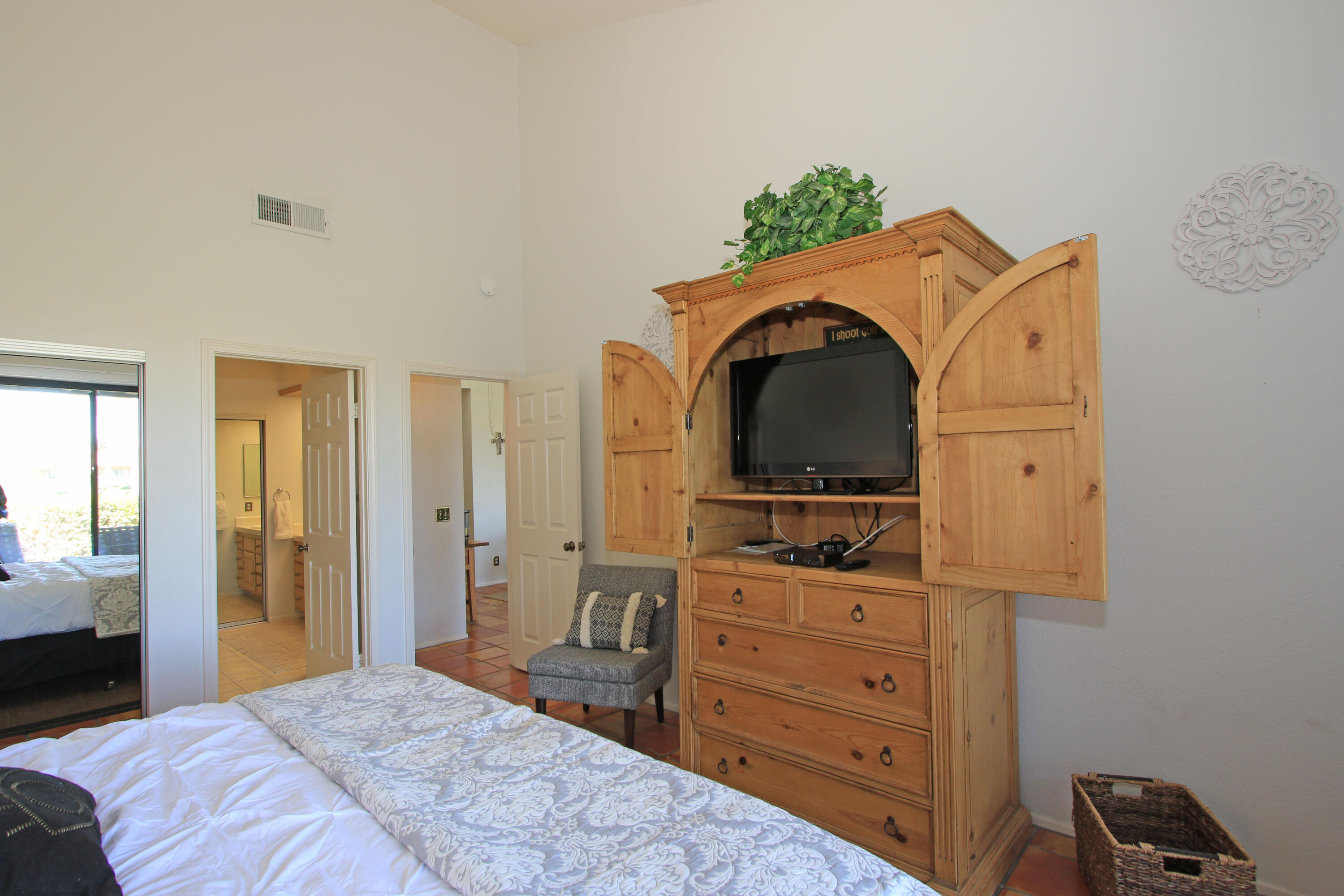72 Old Ranch Road Palm Desert, CA 92211 - Photo 28 of 35 a bedroom with a bed and a dresser in it