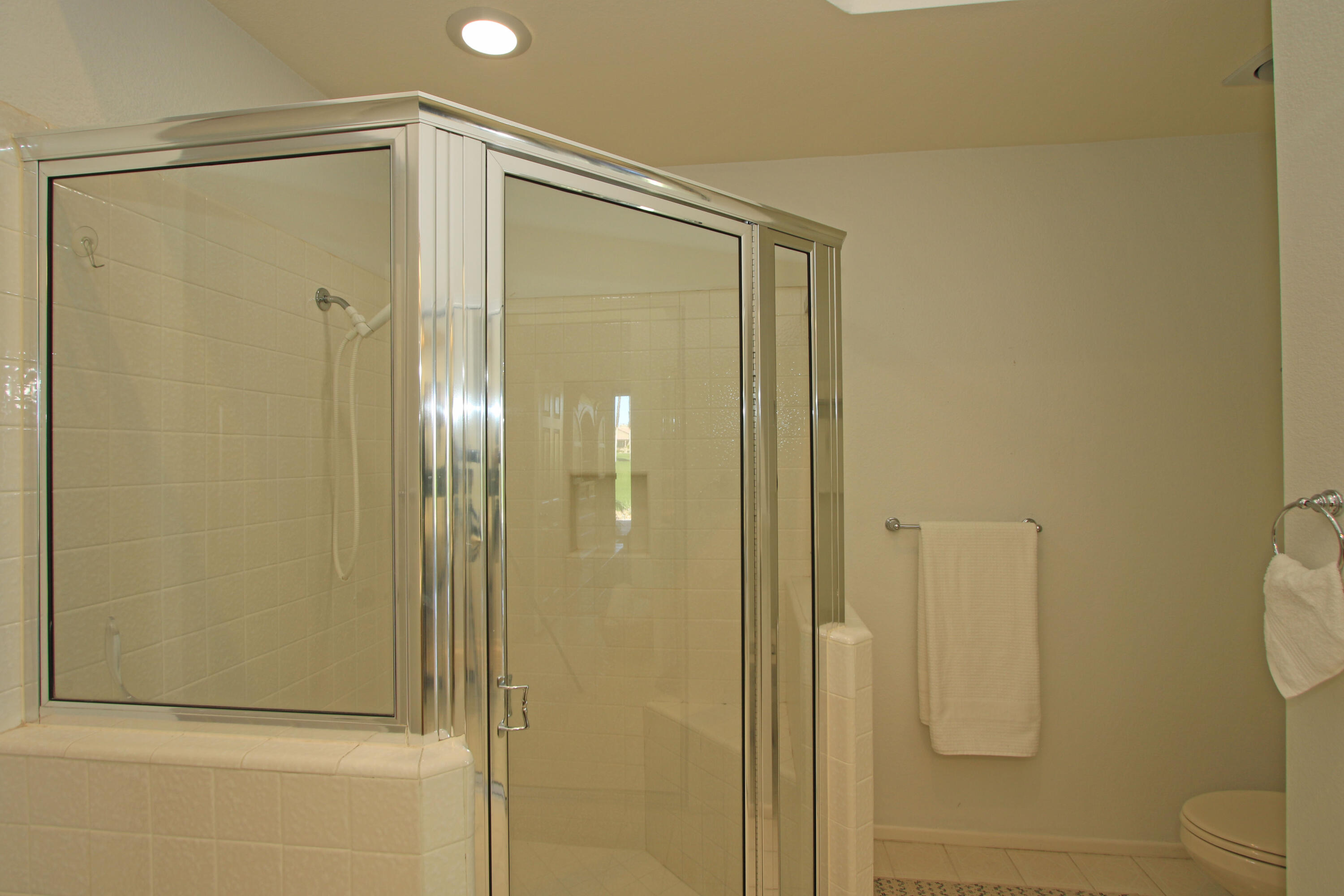 72 Old Ranch Road Palm Desert, CA 92211 - Photo 31 of 35 a bathroom with a glass shower door