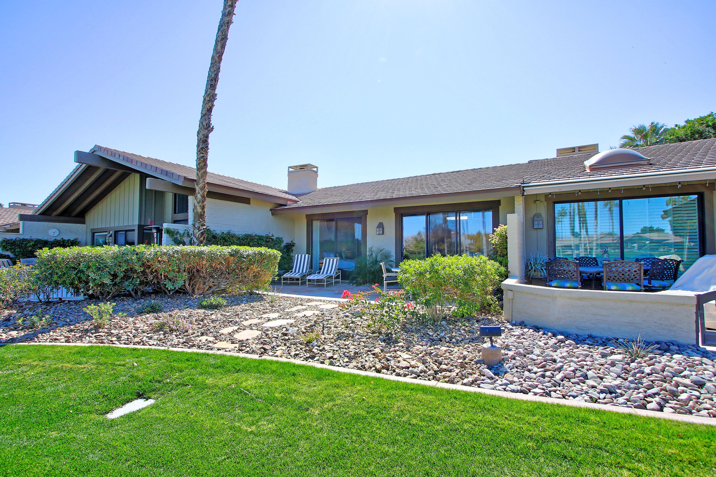 72 Old Ranch Road Palm Desert, CA 92211 - Photo 33 of 35 a front view of a house with garden