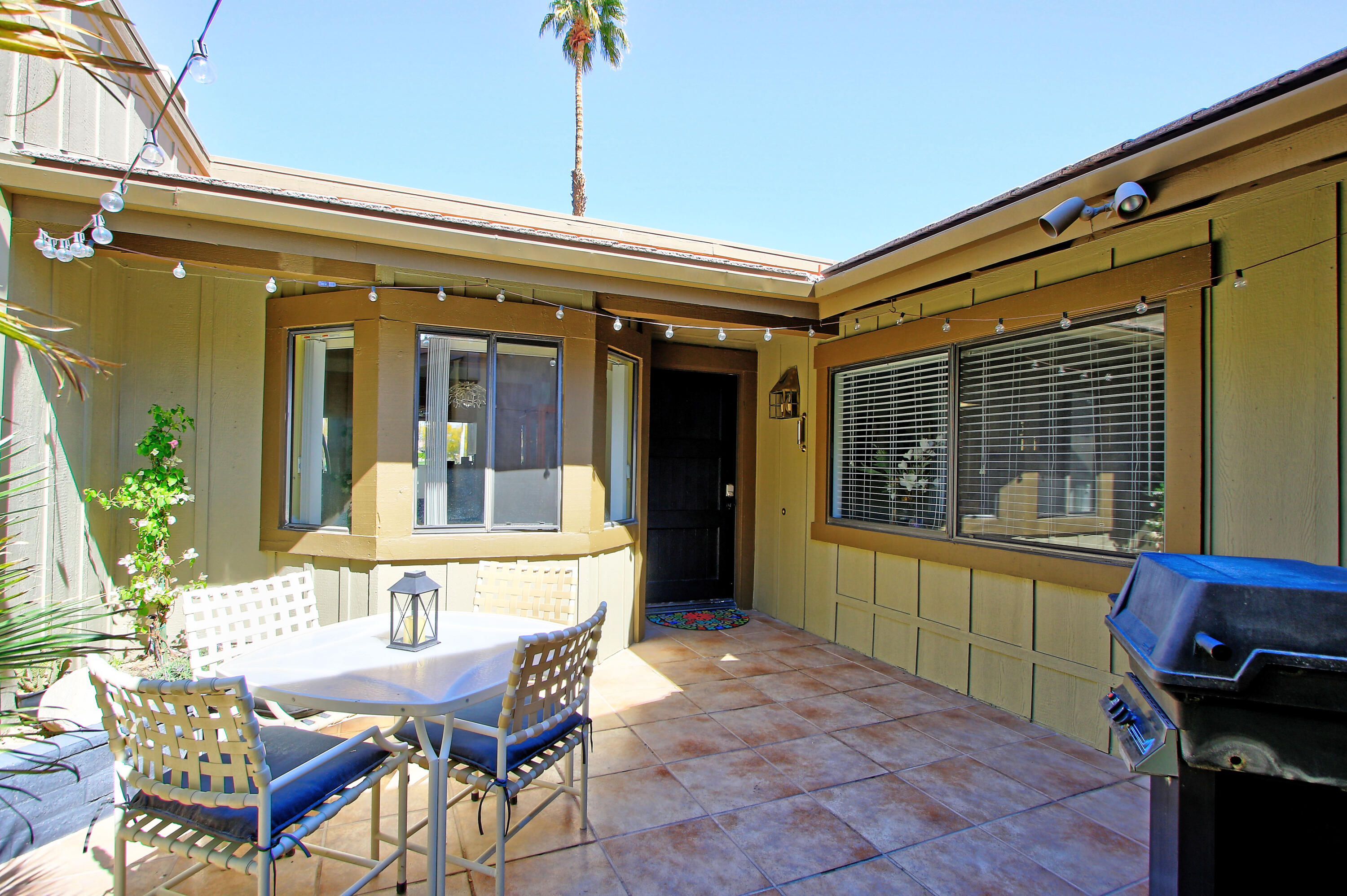 72 Old Ranch Road Palm Desert, CA 92211 - Photo 4 of 35 a view of a dining room with furniture and a window