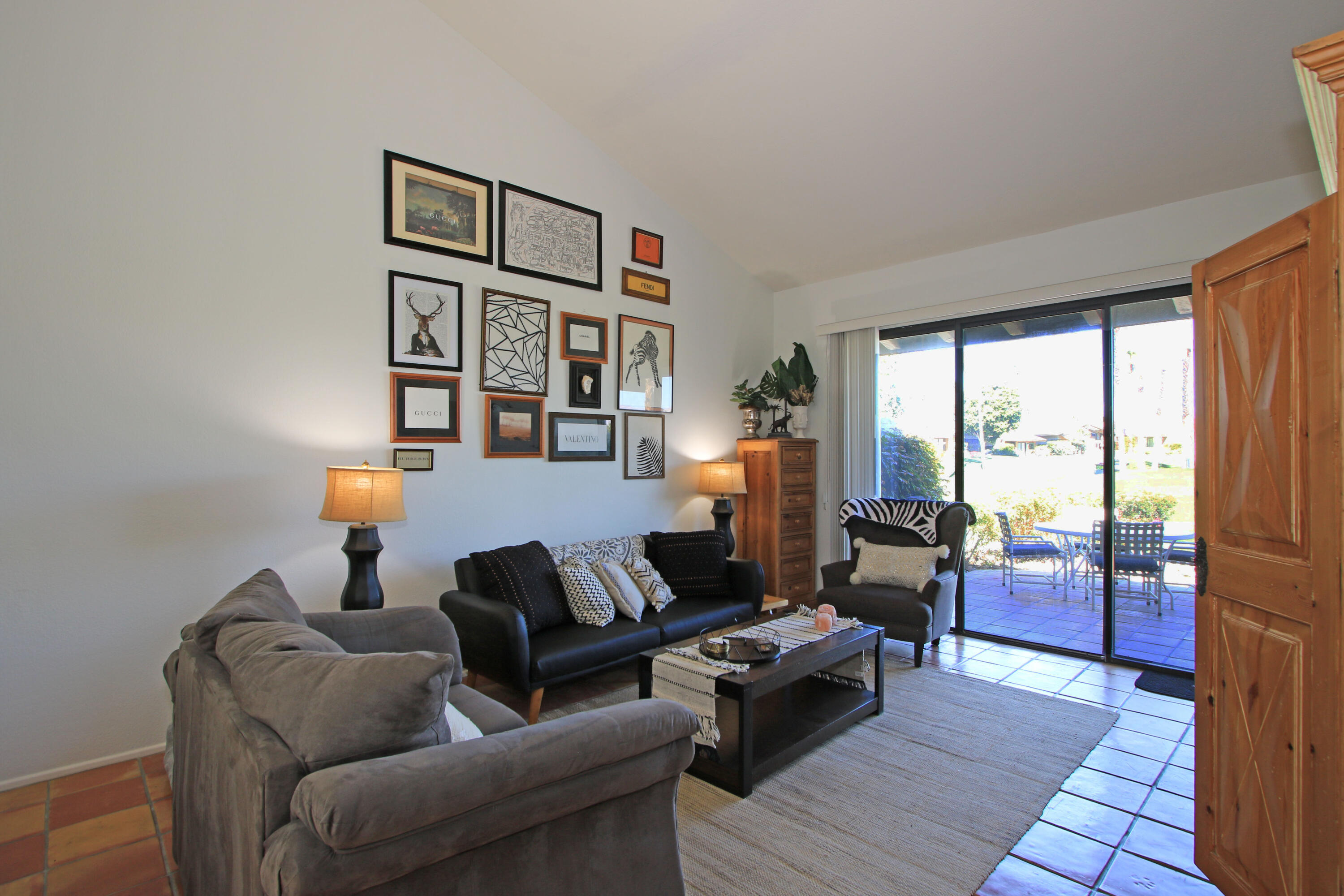 72 Old Ranch Road Palm Desert, CA 92211 - Photo 6 of 35 a living room with furniture and a floor to ceiling window