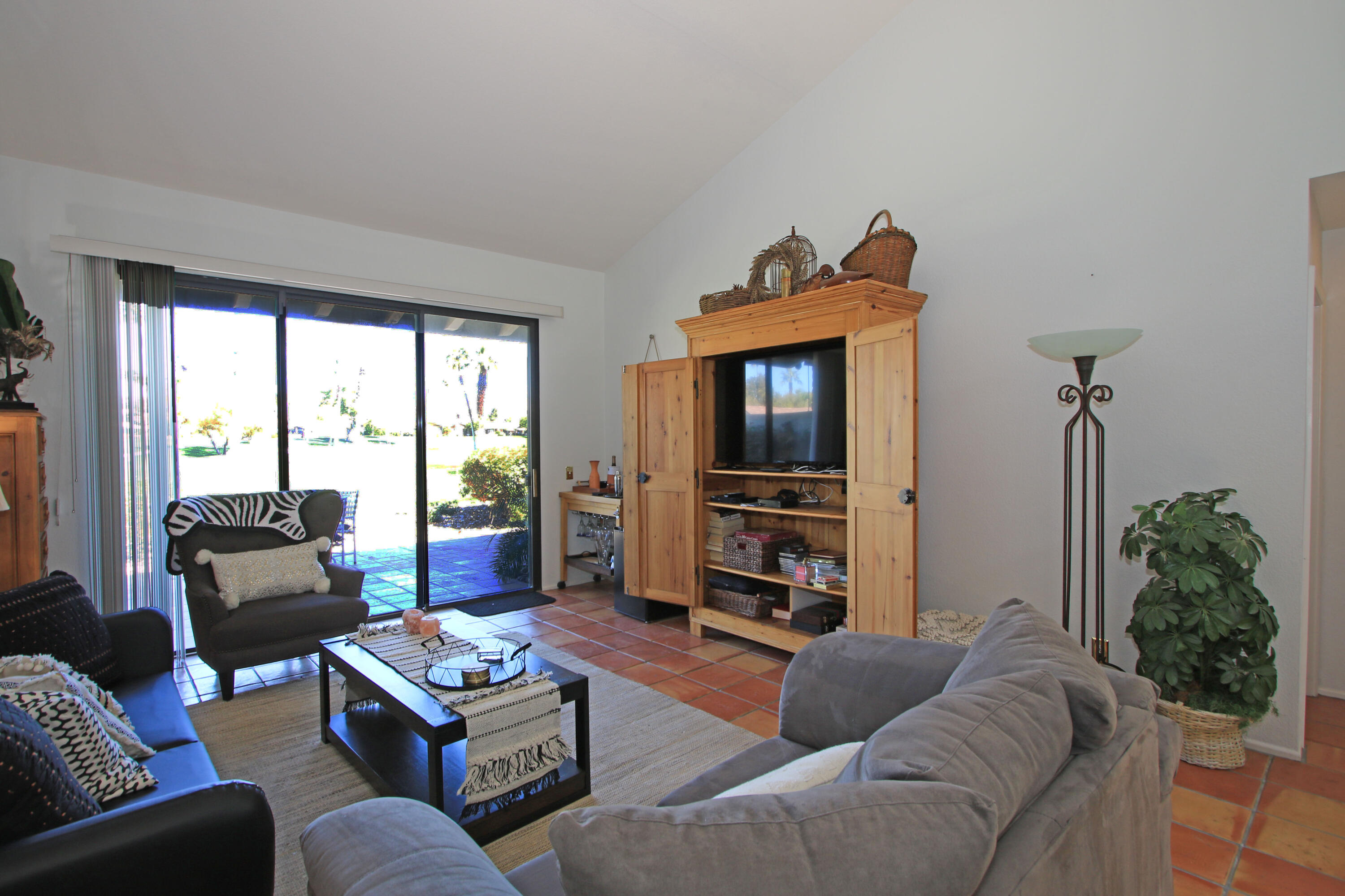 72 Old Ranch Road Palm Desert, CA 92211 - Photo 7 of 35 a living room with furniture and a flat screen tv