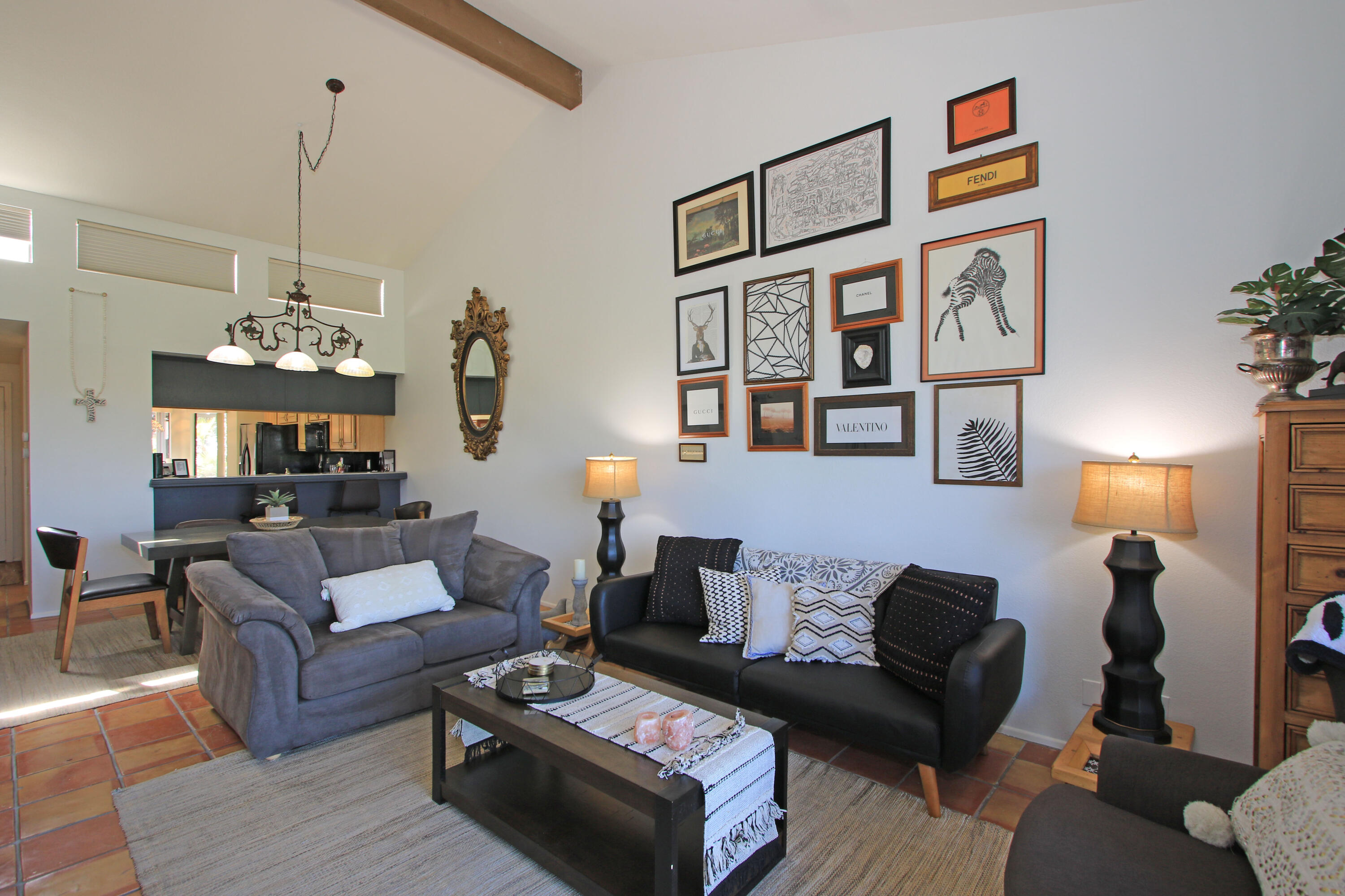 72 Old Ranch Road Palm Desert, CA 92211 - Photo 8 of 35 a living room with furniture a rug and a wall painting