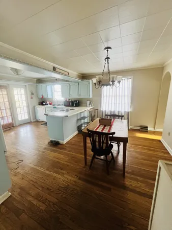 a kitchen with a sink appliances and cabinets